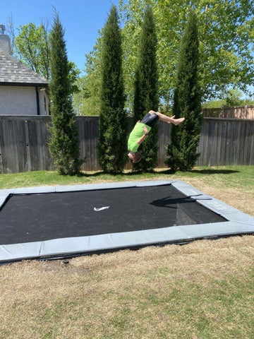 Image of Akrobat 14ft x 10ft Primus Flat In-Ground Trampoline – Grey (Grey Pad with Black Jump Mat)