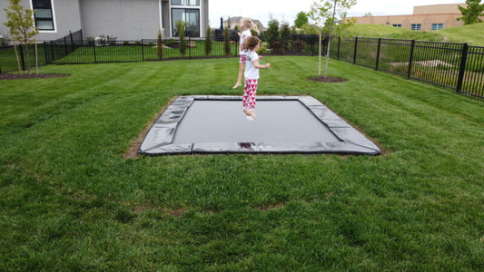 Akrobat 14ft x 10ft Primus Flat In-Ground Trampoline – Black (Black Pad with Grey Jump Mat)